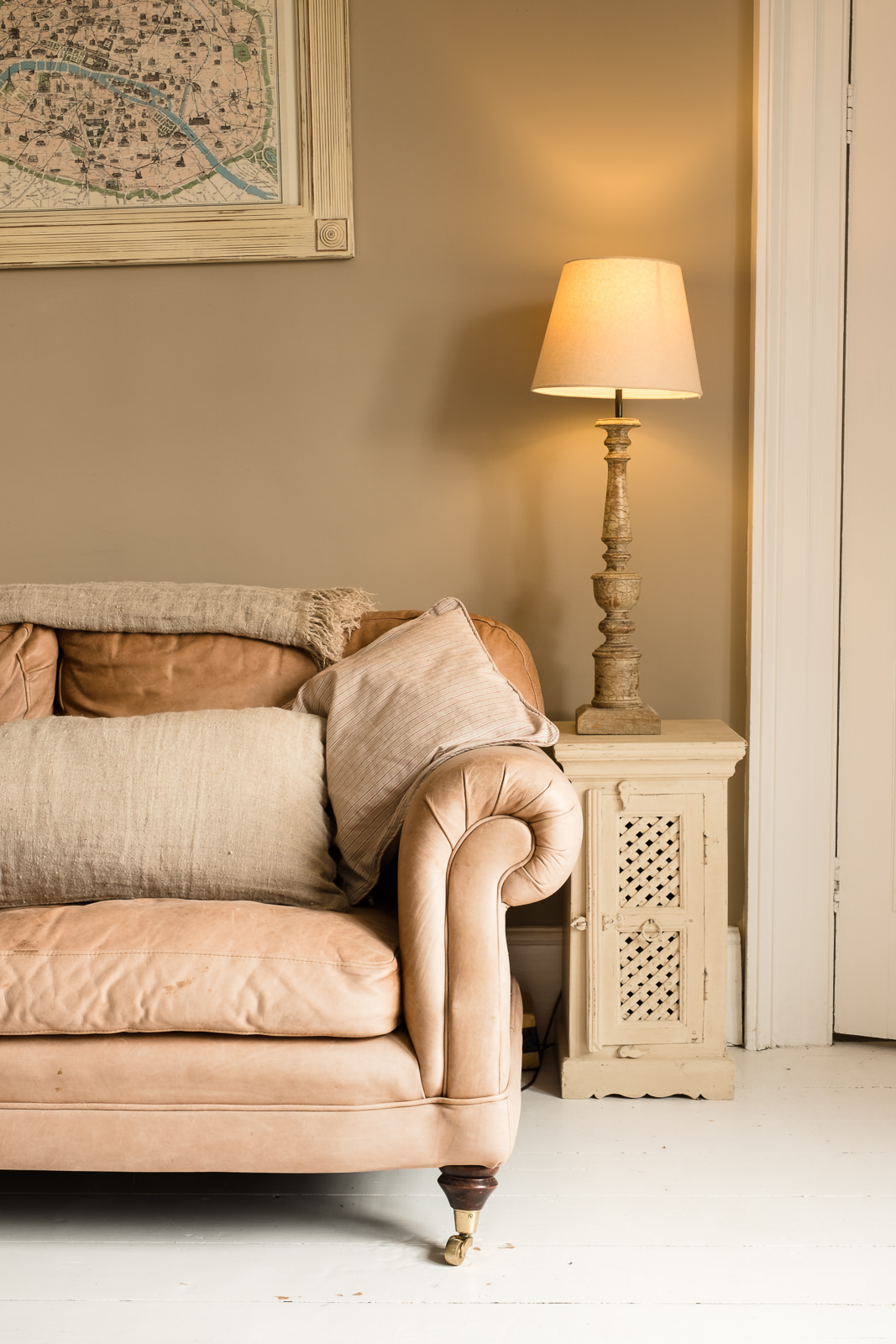 Corporate marketing photography with image showing partial view of a classically designed settee in farmhouse lounge