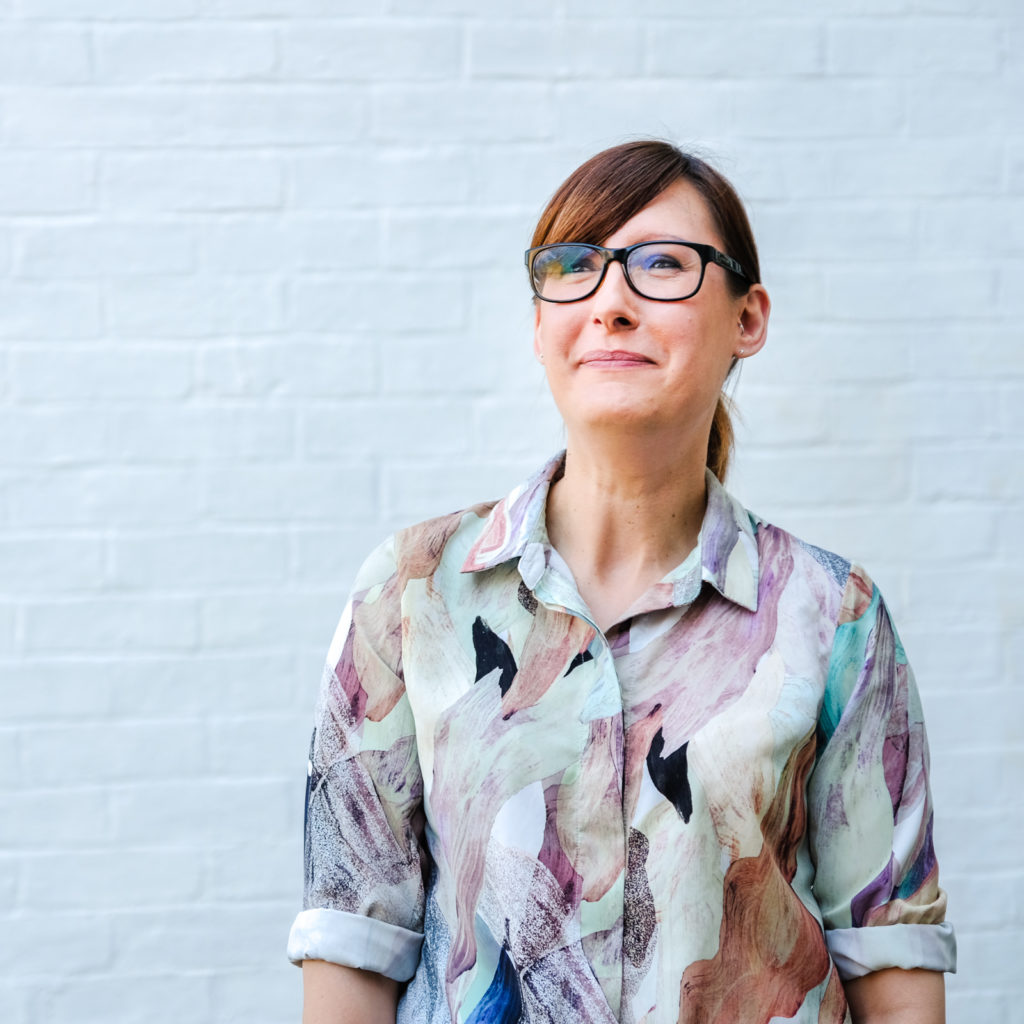Corporate marketing photography with image from a series showing a female student with a hopeful and positive expression and used in marketing material by the charity Action on Addiction