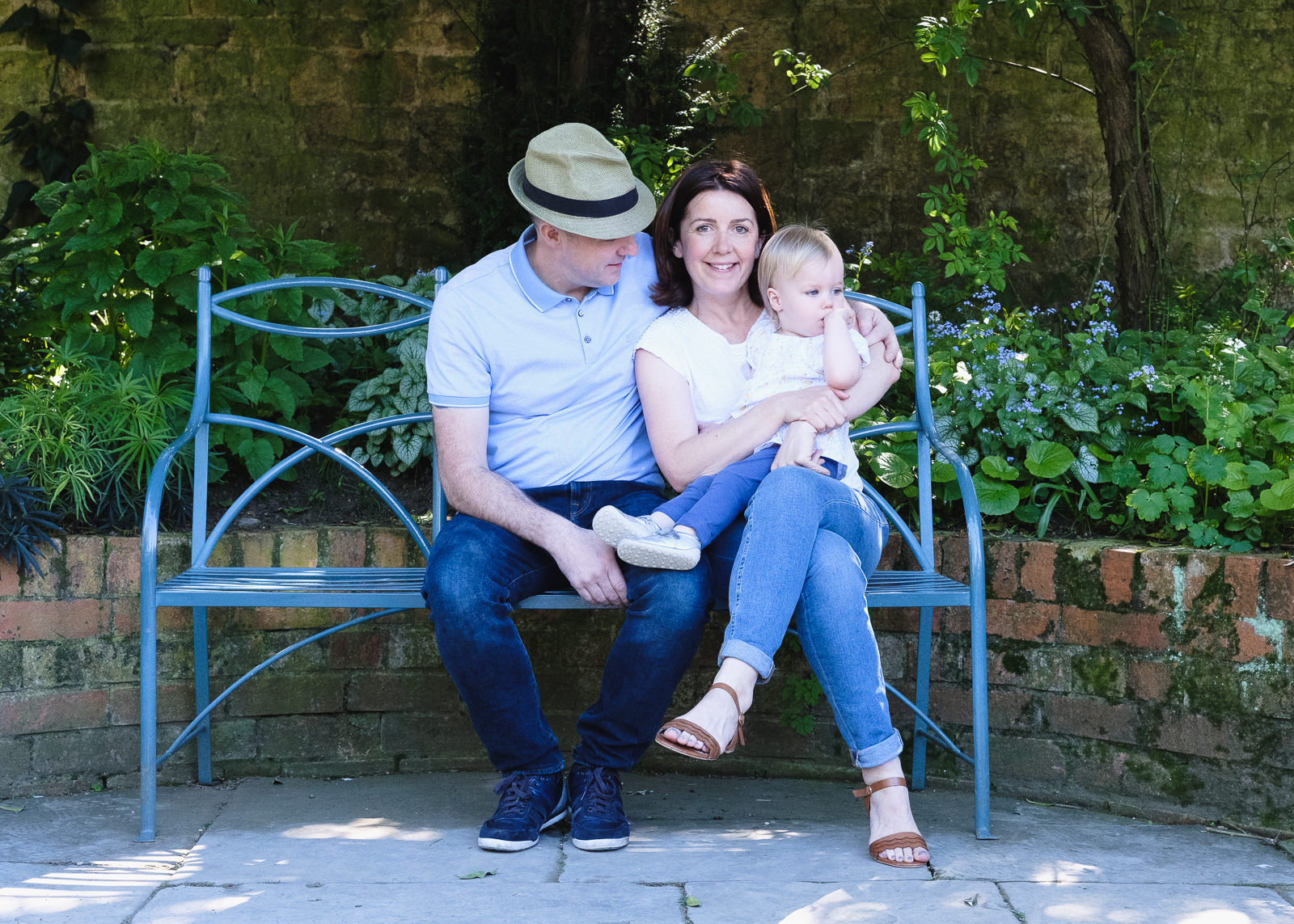 Family photography - enjoying a peaceful moment in country house gardens