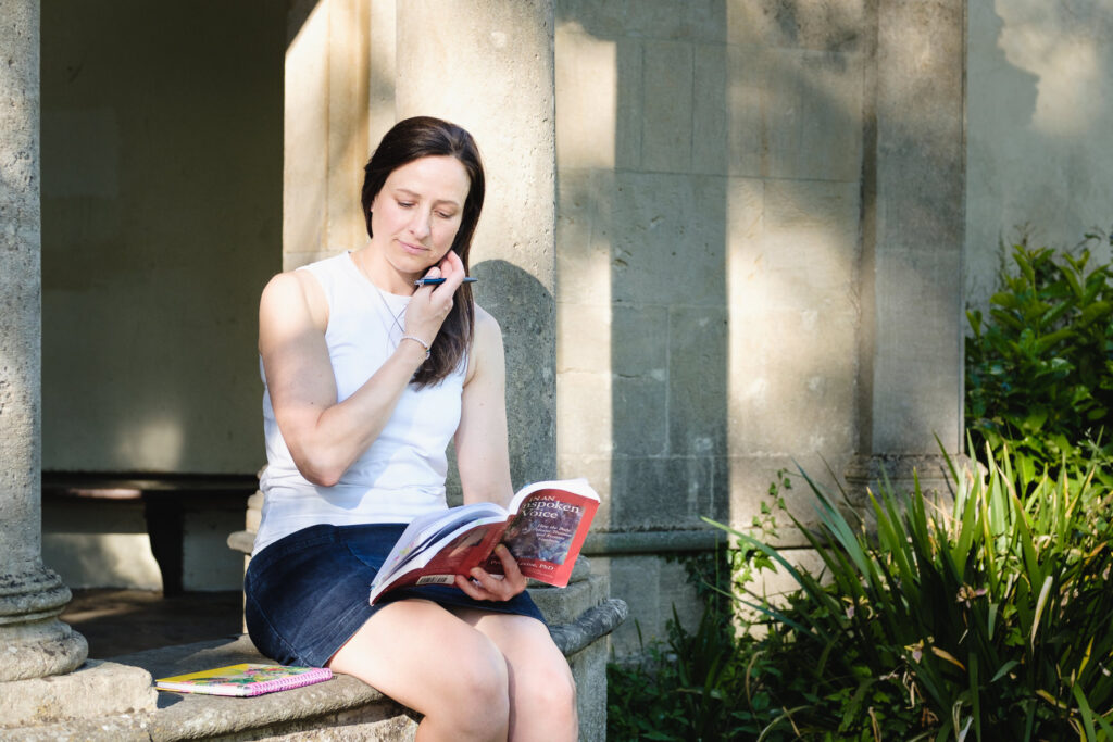 Business owner reading a book out doors