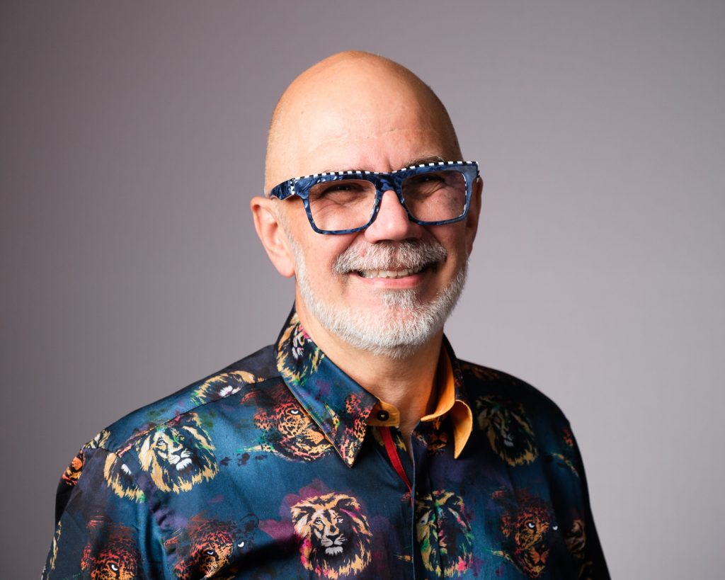 Confident marketing consultant male headshot photography in a studio