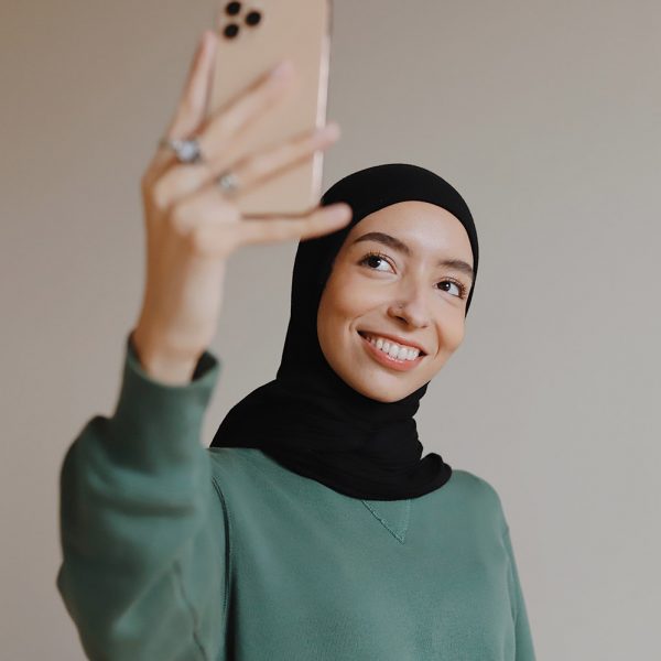Young Asian woman taking a selfie