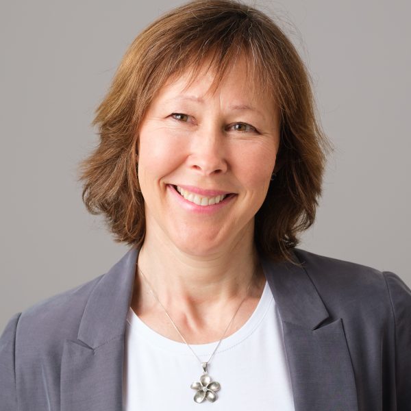 Relaxed headshot of a female healthcare professional