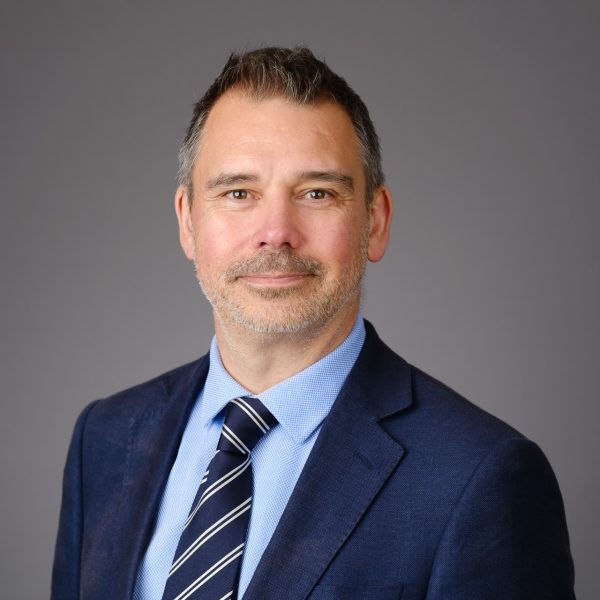 Relaxed headshot male market research director