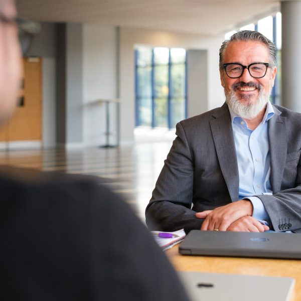 Male executive having a relaxed business conversation with a client