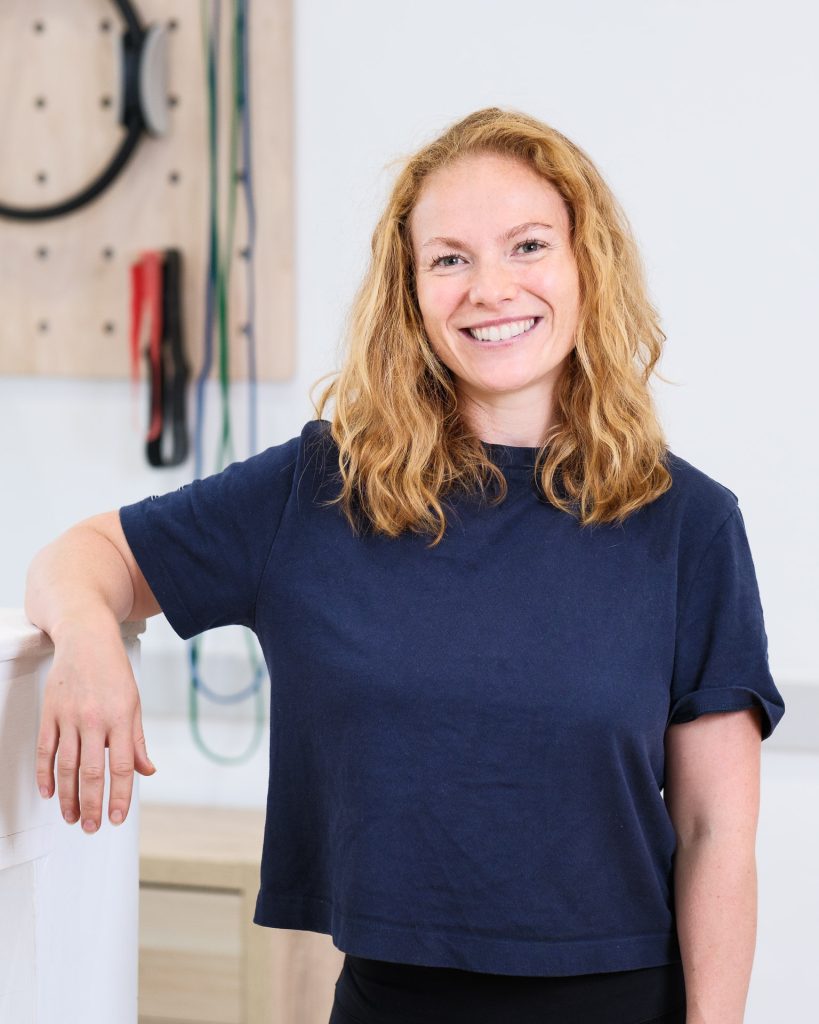 Relaxed headshot of a female physiotherapist at The Pure Practice in Bath
