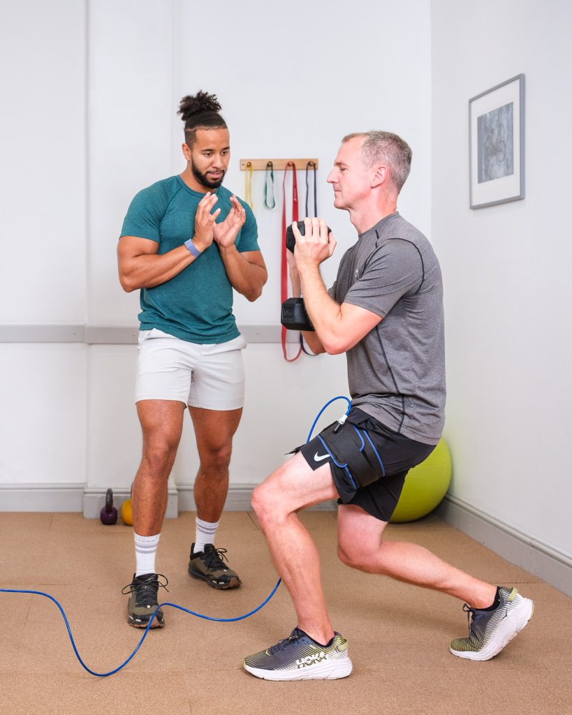 Male client having a one to one physiotherapy session