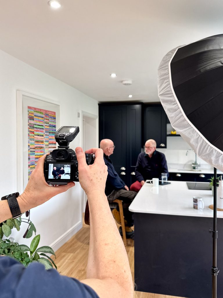 Nick Cole photographing a Premier Heating Solutions client consultation