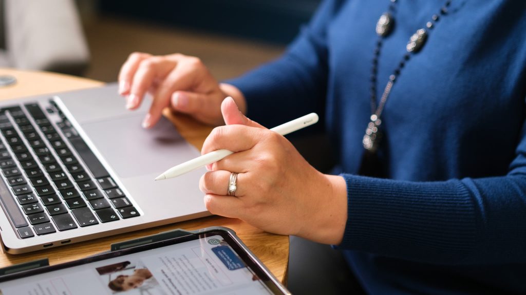 Female marketing manager preparing her business photography planning checklist