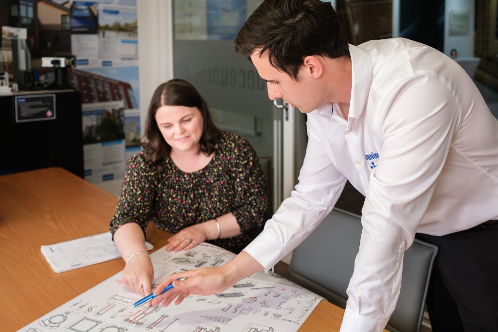 Manufacturing photography showing a technical sales manager in conversation with a client