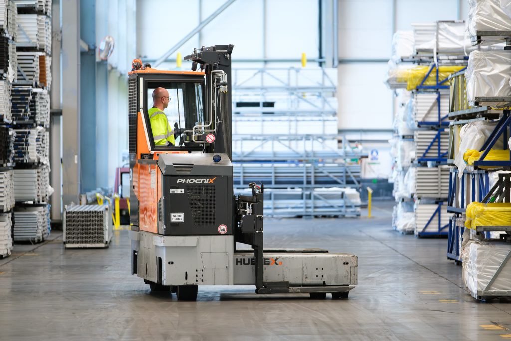 Manufacturing photography showing a fork lift truck operating in a warehouse