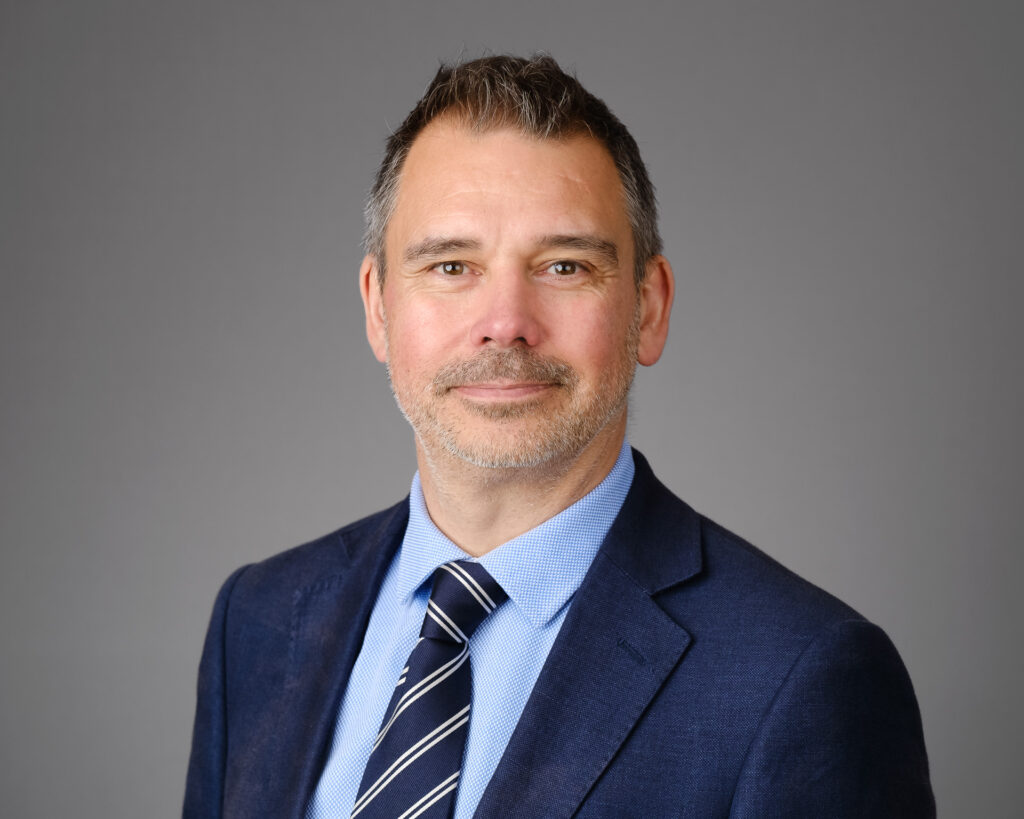 Relaxed headshot male market research director