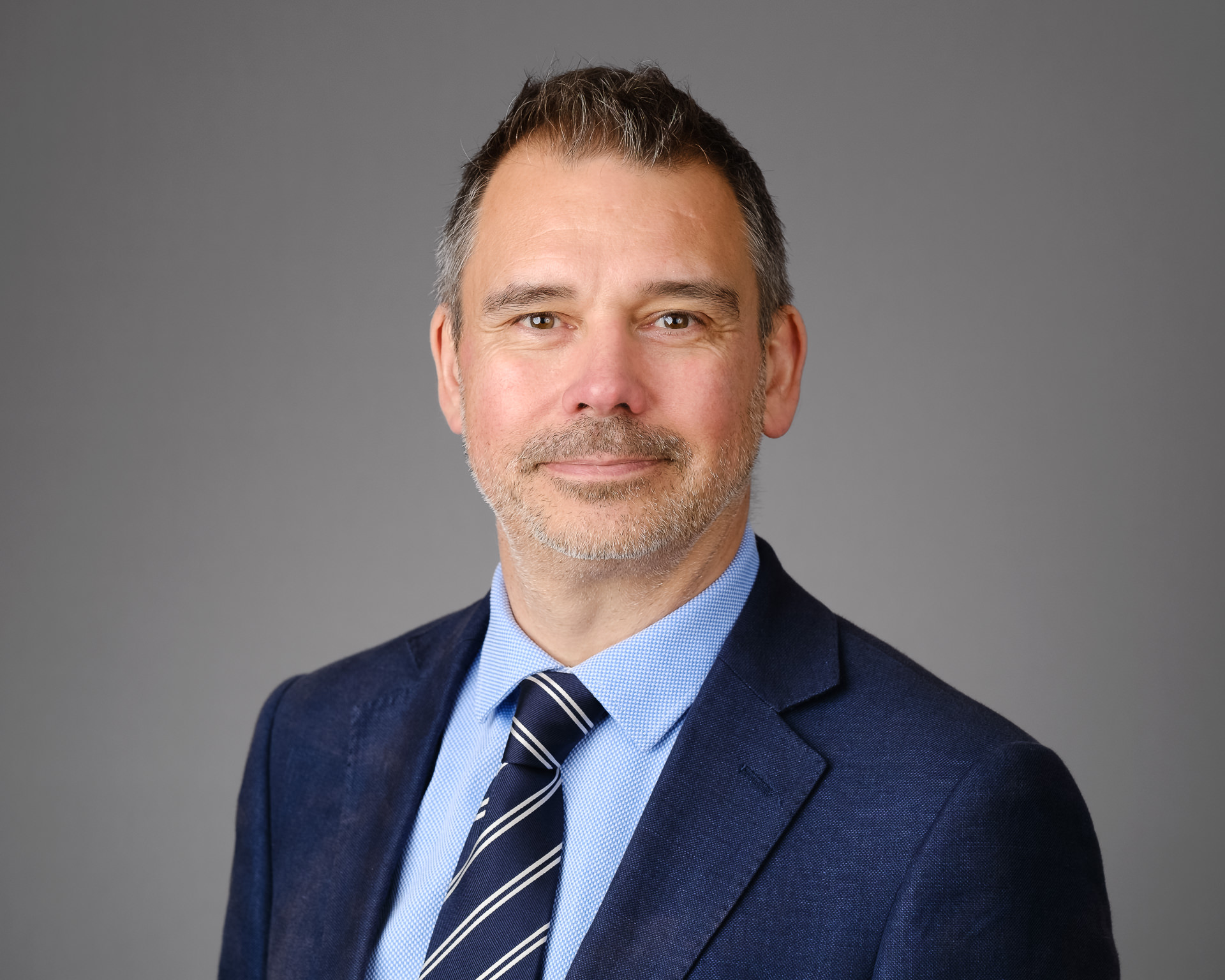 Relaxed headshot male market research director