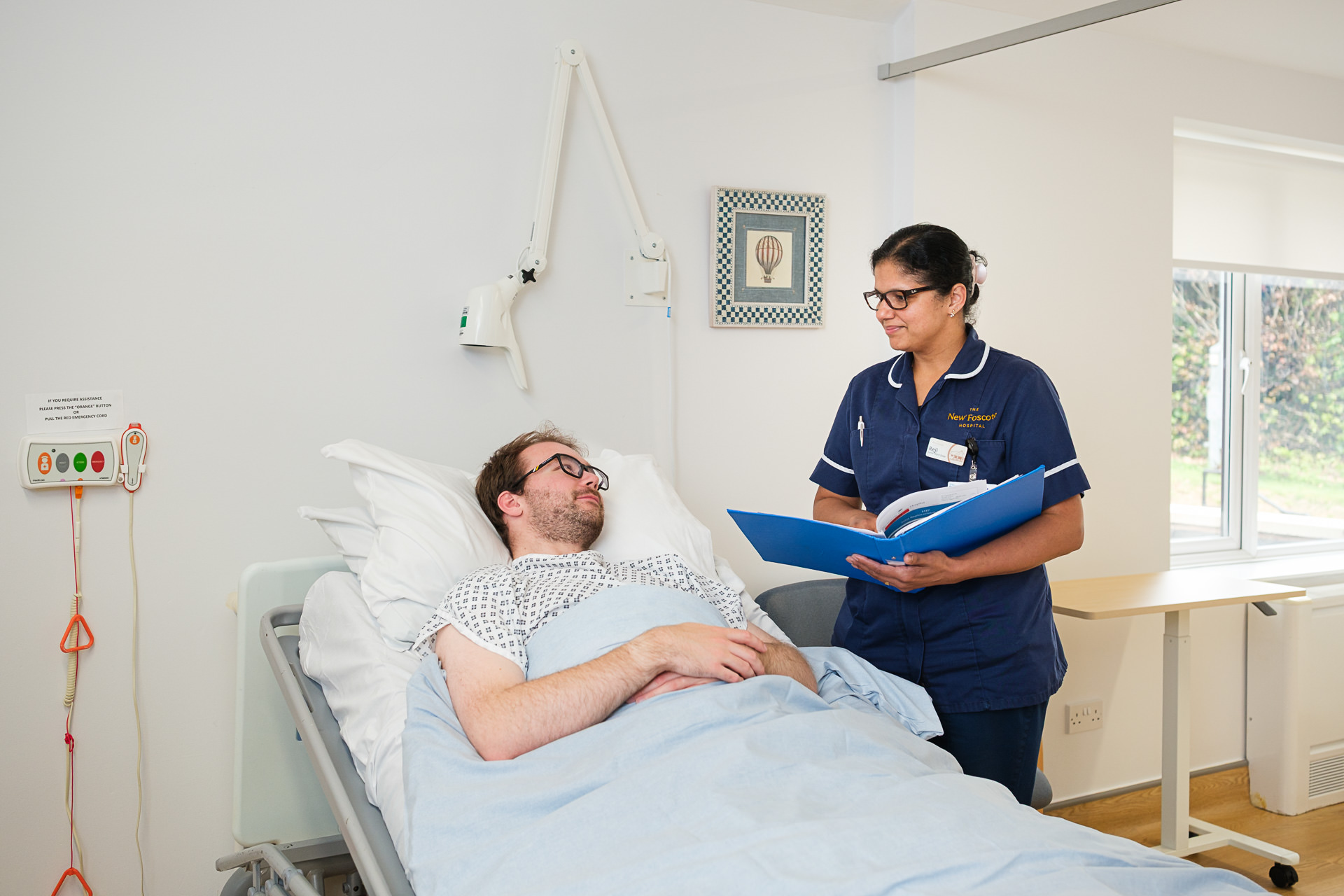 Nurse speaking with a patient during a private room consultation at The New Foscote Hospital, Banbury