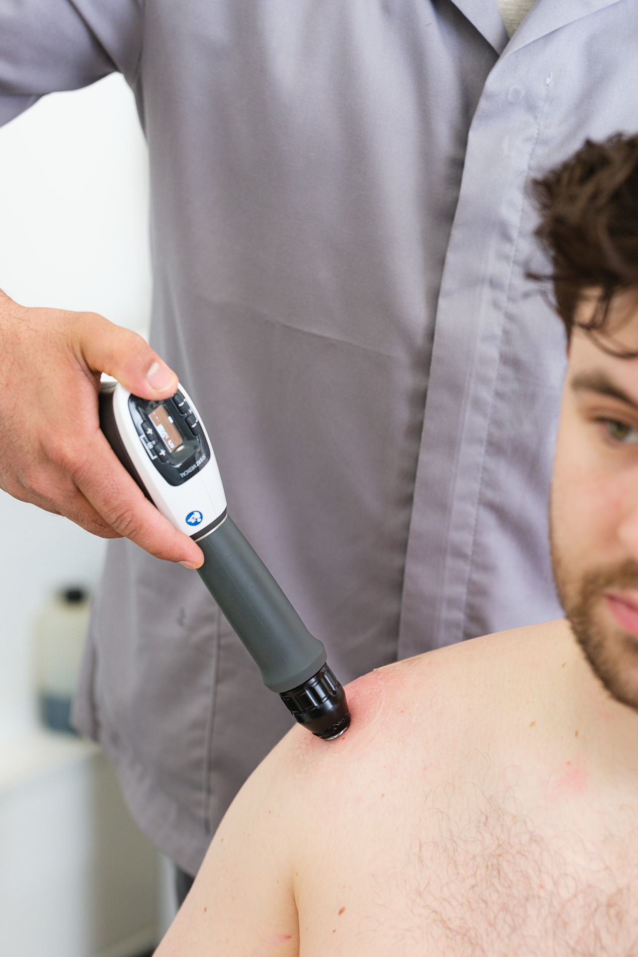 Close-up of a physiotherapy procedure being performed in a private hospital setting