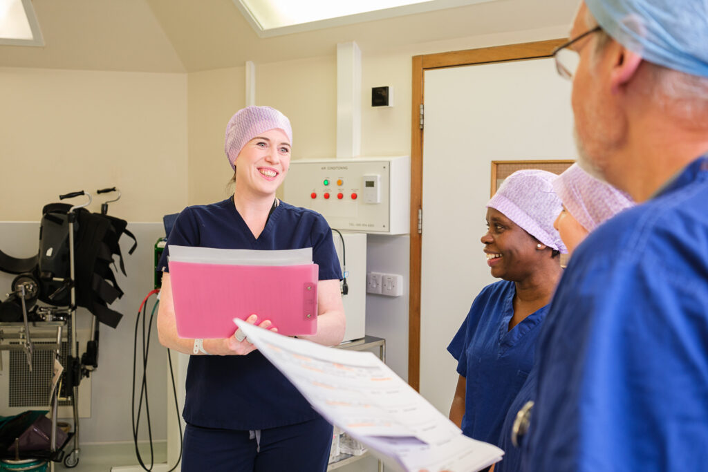 Hospital staff discussing patient care in a clinical environment at The New Foscote Hospital