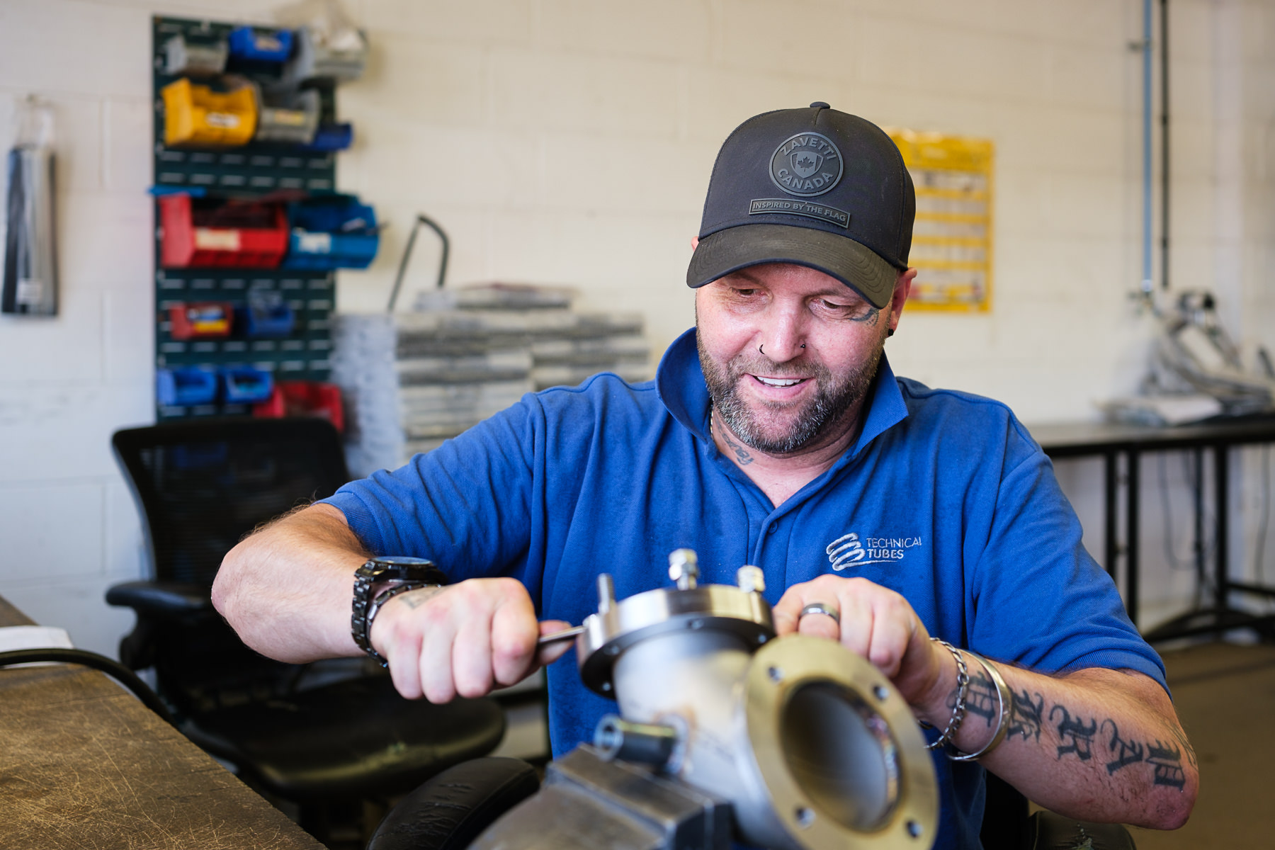 Engineer completing final assembly of a fabricated metal component