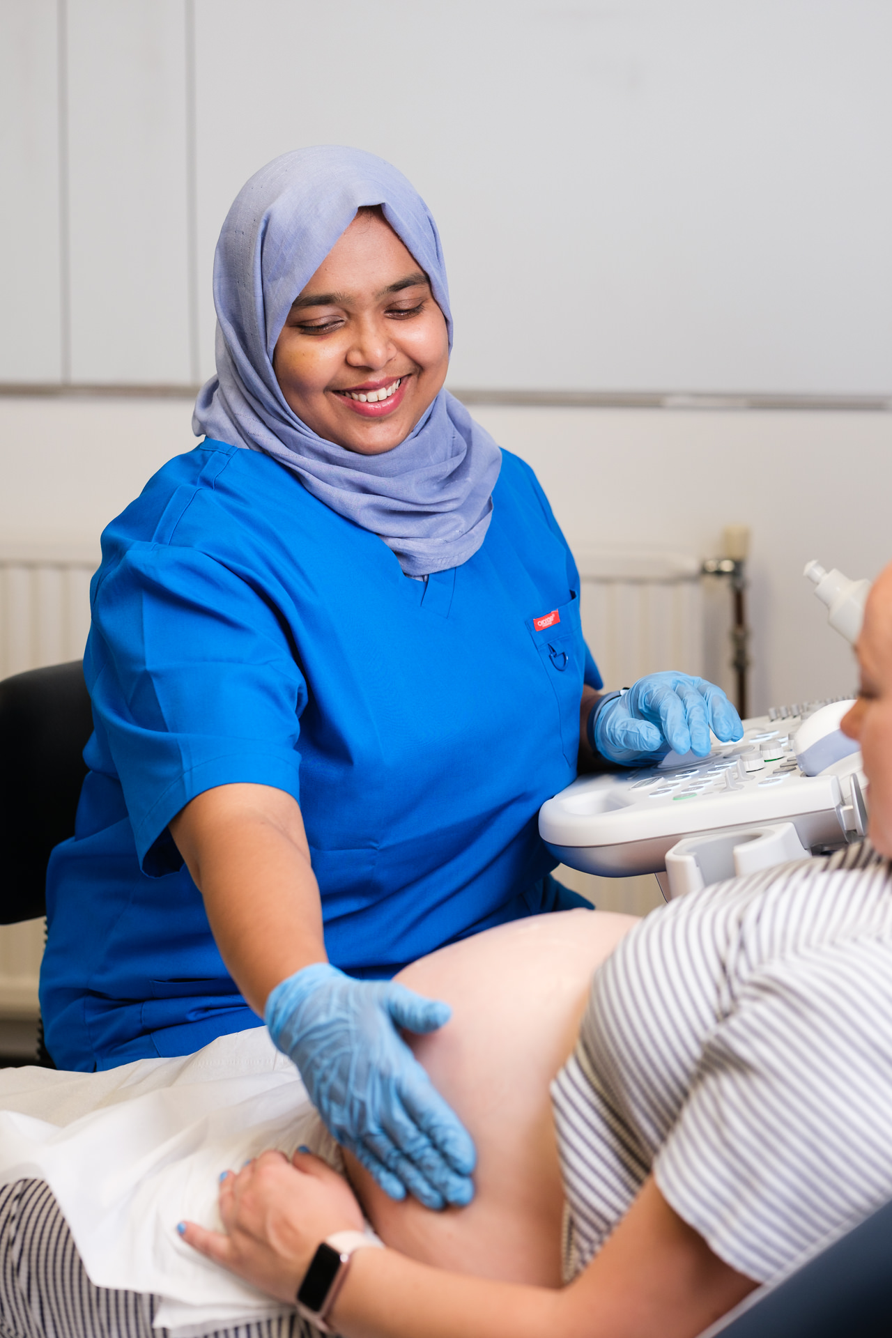 Sonographer wearing a headscarf performing an ultrasound scan for a patient at Ultrasound Elite in Sheffield.