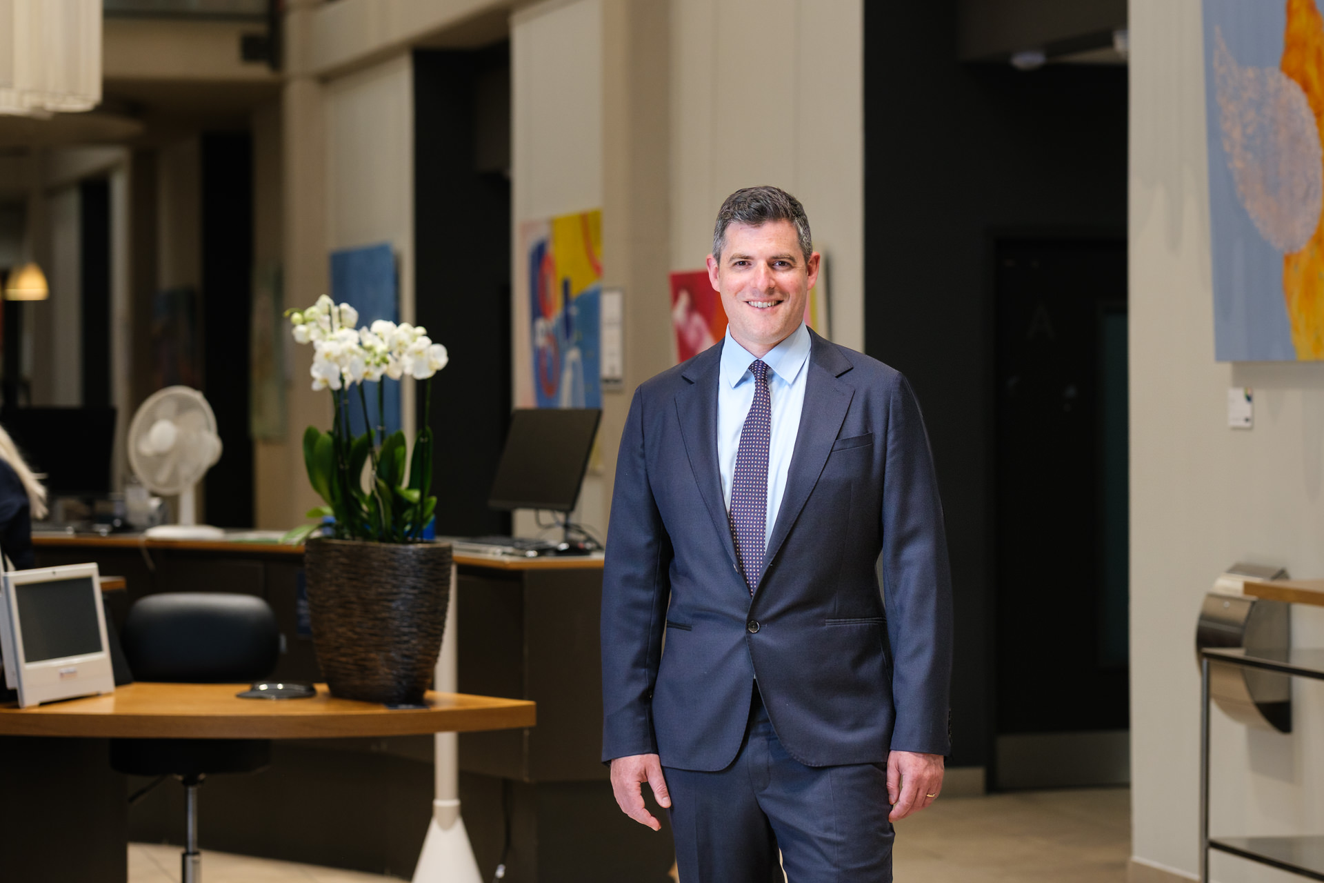 Portrait of consultant orthopaedic surgeon James Berwin in a private hospital reception area in Bath.